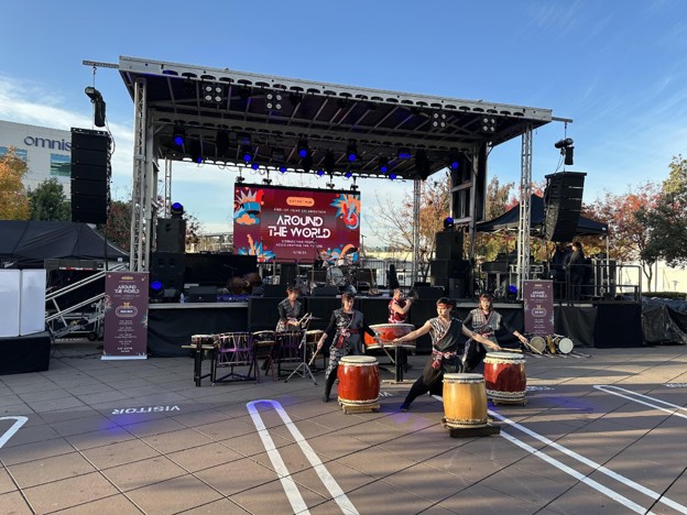 A drum demonstration performance in front of a professionally designed AV set up.